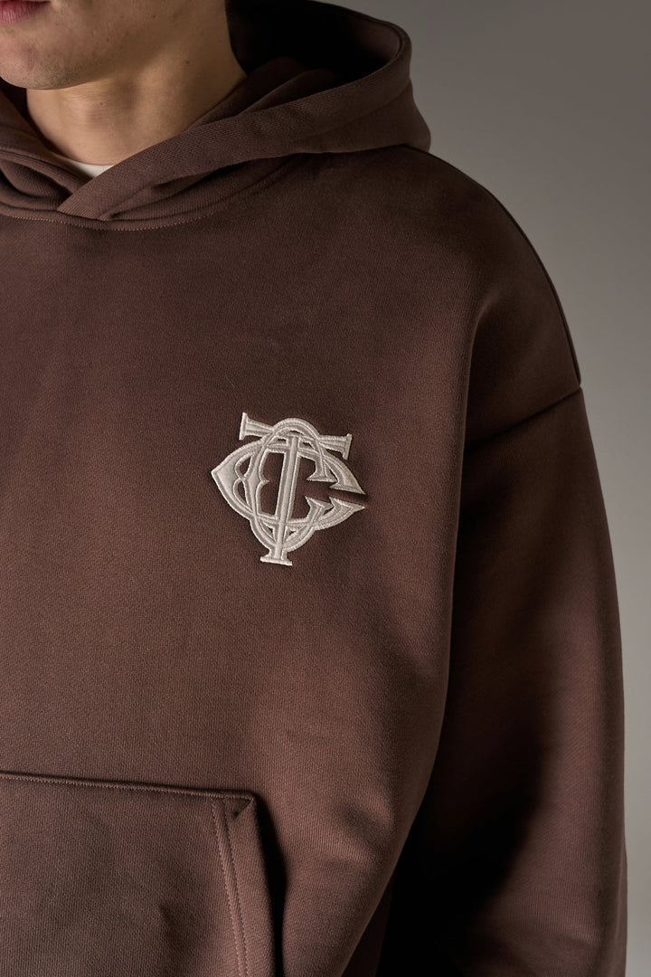 HEAVYWEIGHT MONOGRAM APPLIQUE EMBLEM HOODIE BROWN