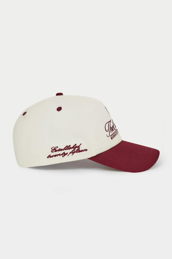 White and red baseball cap with text on a white background