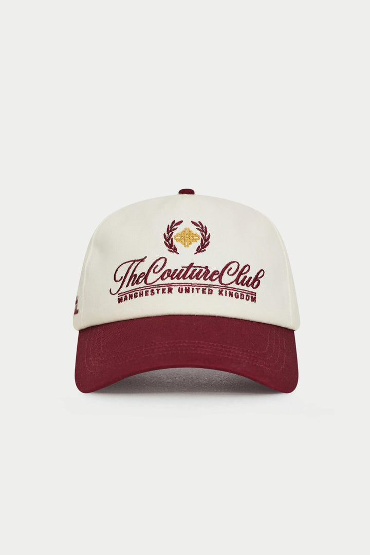 Cap with 'The Couture Club' logo on a white background